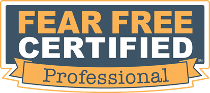 The image shows a certification badge that reads "Fear Free Certified Professional." The text is displayed within a rectangular shape, with "Fear Free Certified" in a blue background and "Professional" in a yellow ribbon banner beneath it, ideal for any veterinarian or vet.